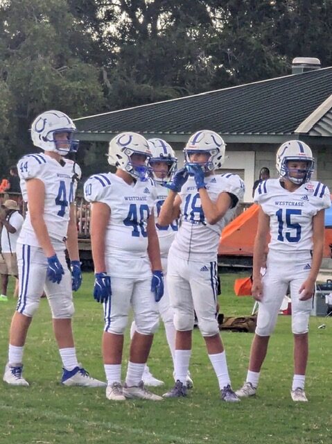 Youth tackle football players